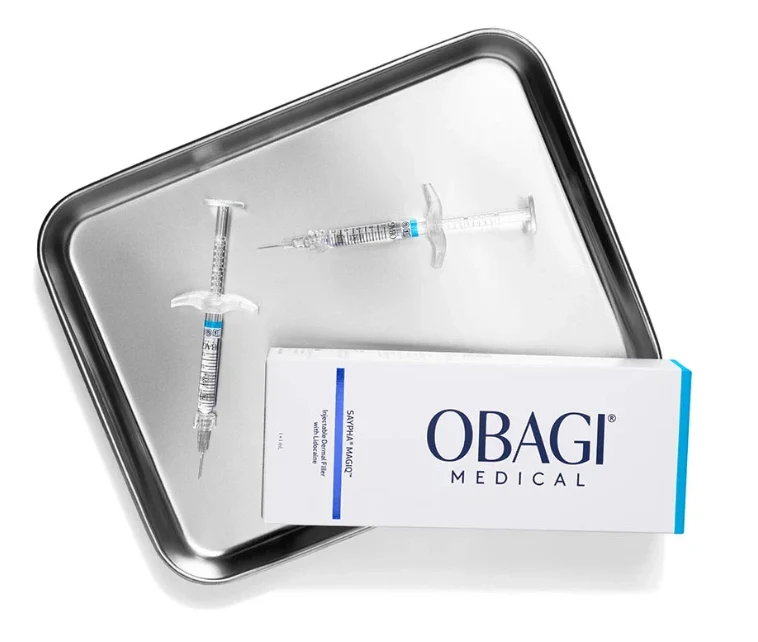 Obagi Medical dermal filler box with two injectable syringes resting on a metal medical tray.